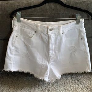 White ripped shorts